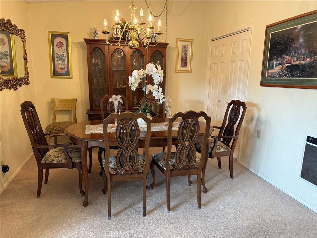 1441 Homewood Road Seal Beach, CA 90740 - Photo 9 of 25 a dining room with furniture and chandelier