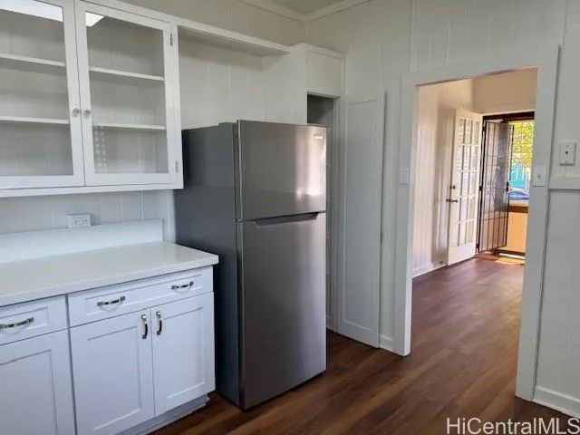 a kitchen with cabinets and stainless steel appliances