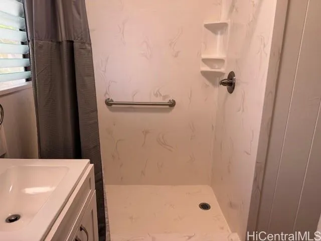 a bathroom with a tub and a shower