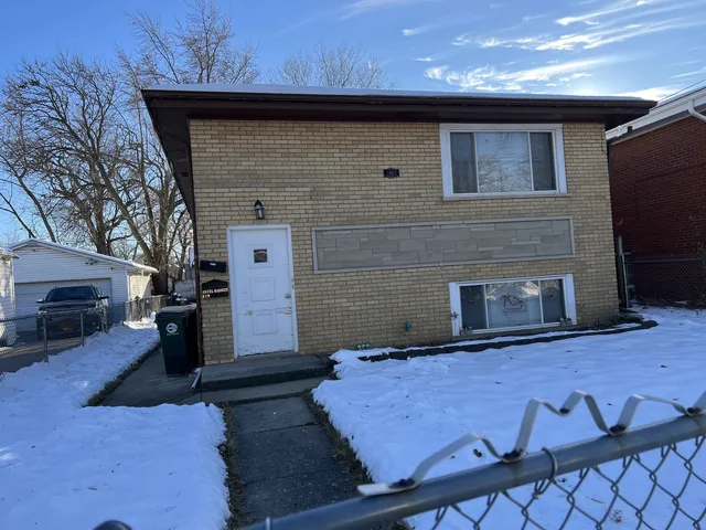 a front view of a house with parking area