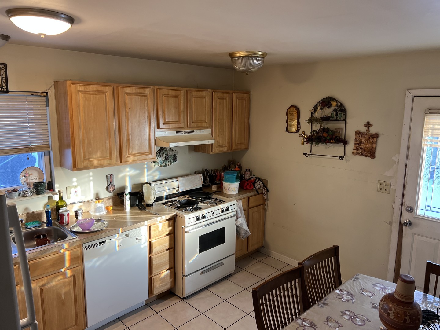 1105 Indian Avenue Aurora, IL 60505 - Photo 12 of 35 a kitchen with a stove a sink and cabinets