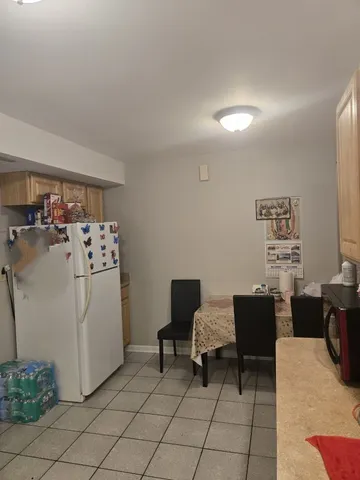 a view of a workspace with furniture and a couch