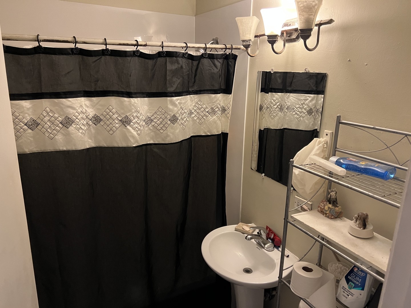 1105 Indian Avenue Aurora, IL 60505 - Photo 14 of 35 a bathroom with a sink and a mirror