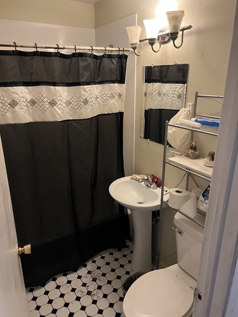 1105 Indian Avenue Aurora, IL 60505 - Photo 15 of 35 a bathroom with a sink and a toilet