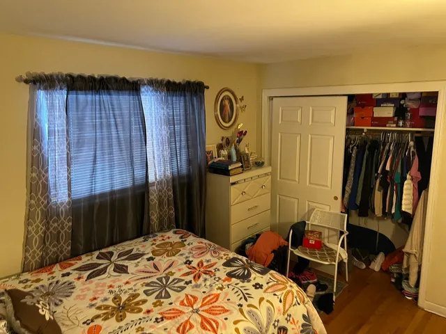 a bedroom with a bed and a closet