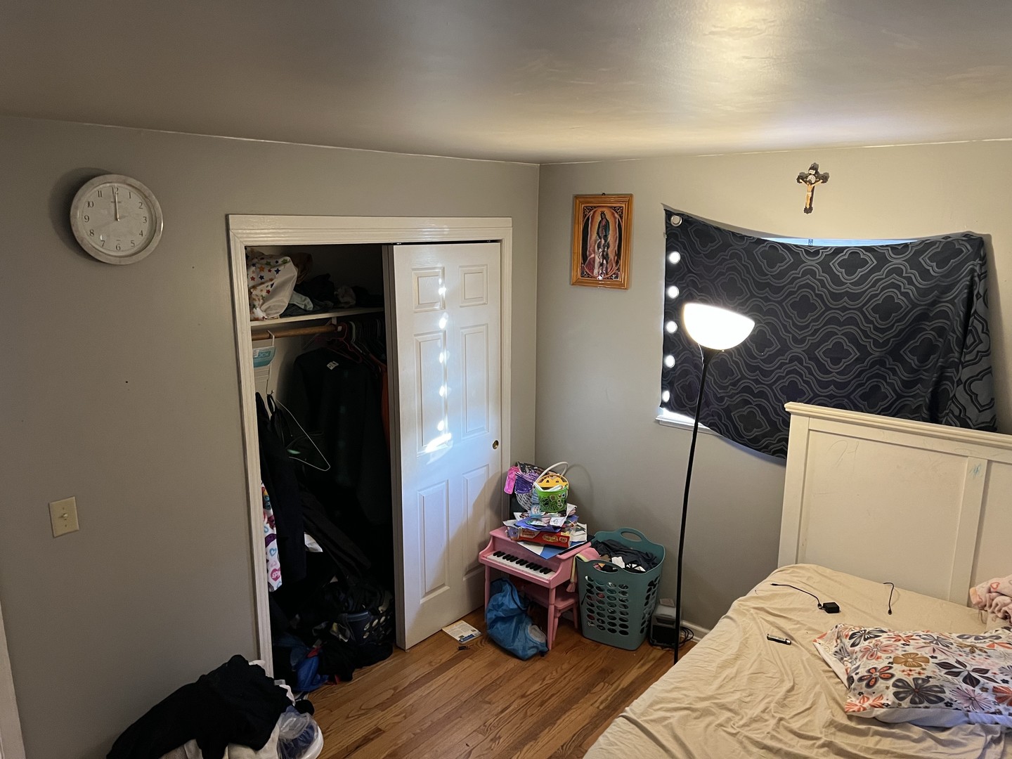 1105 Indian Avenue Aurora, IL 60505 - Photo 23 of 35 a bedroom with a bed and a chandelier