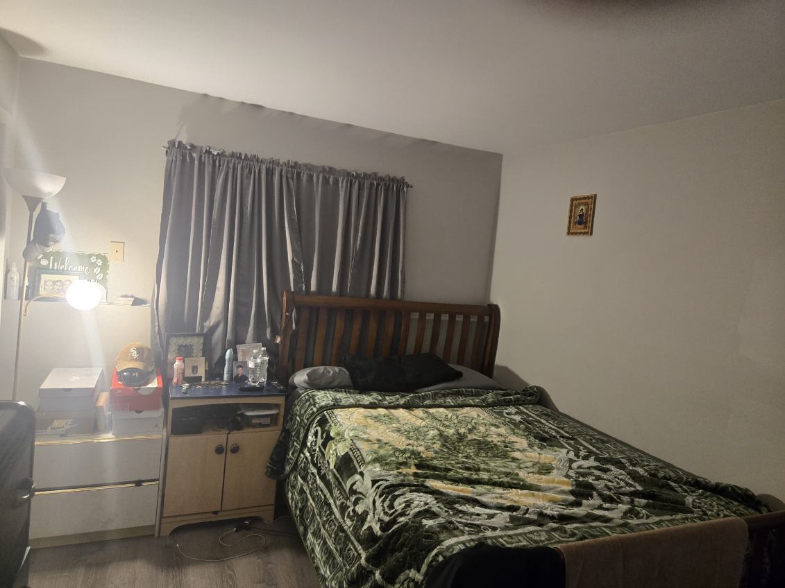 1105 Indian Avenue Aurora, IL 60505 - Photo 28 of 35 a bed sitting in a bedroom next to a window