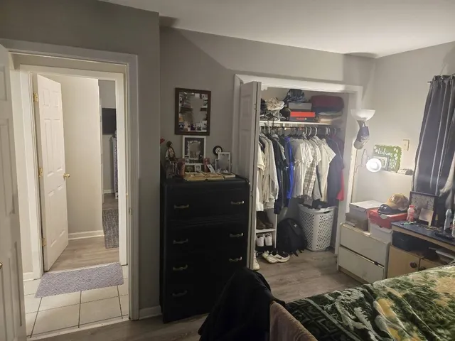 a kitchen with a refrigerator and a stove