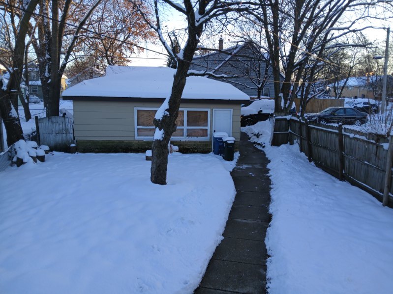 1105 Indian Avenue Aurora, IL 60505 - Photo 32 of 35 a view of a backyard with table and chairs under a large tree