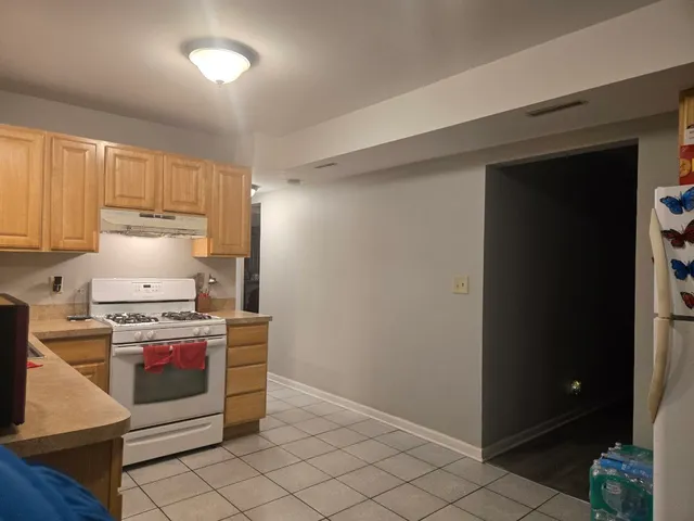 a kitchen with a stove and a refrigerator