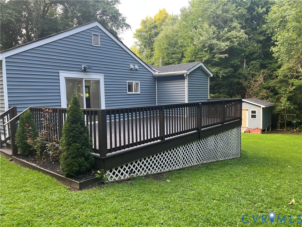 3074 Rocky Ford Road Crewe, VA 23930 - Photo 7 of 48 Expansive outdoor deck with dark railing and latti