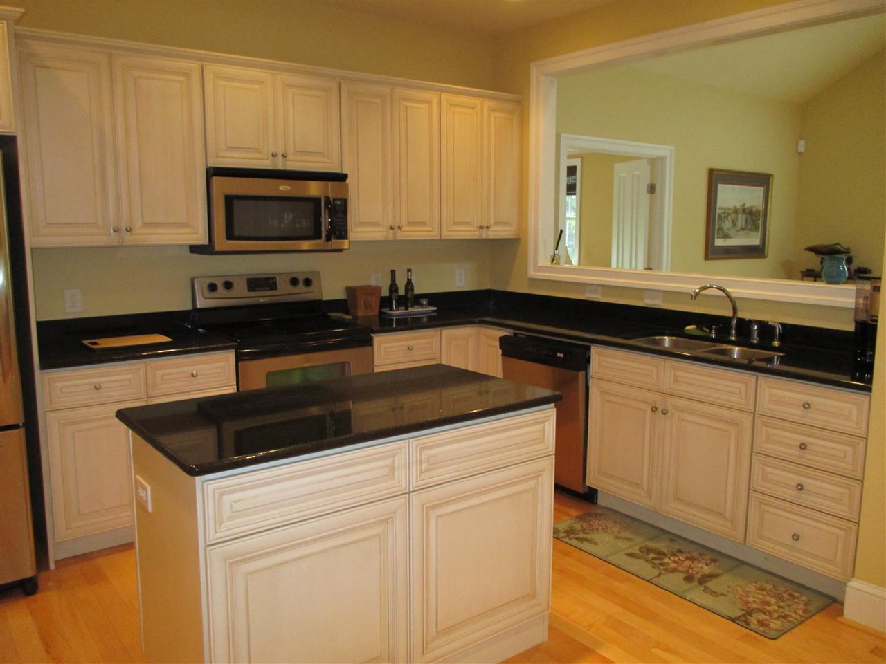 121 A Overlook Road Staunton, VA 24401 - Photo 5 of 21 a kitchen with granite countertop white cabinets and black appliances