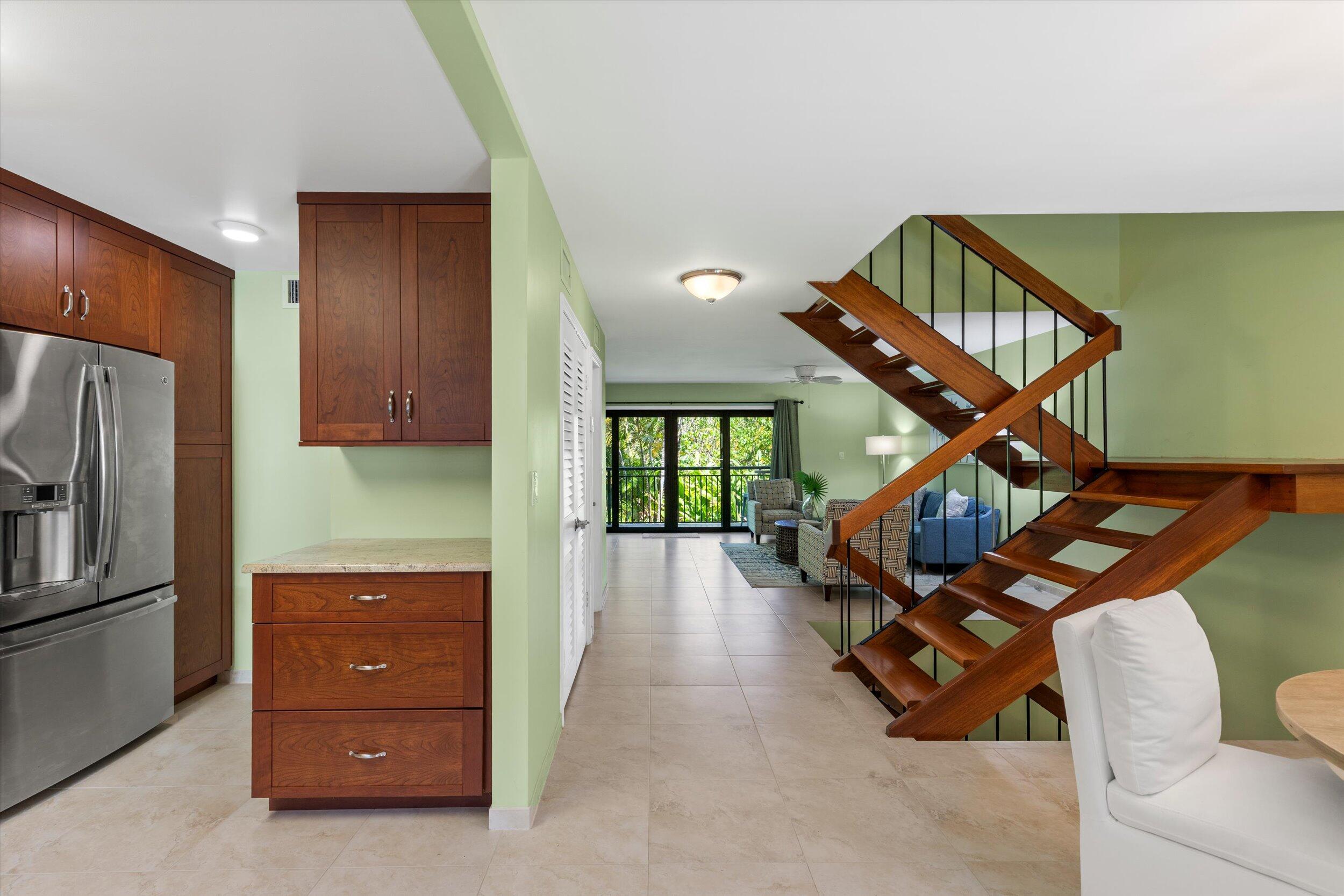 1616 Atlantic Boulevard, Unit 13 Key West, FL 33040 - Photo 13 of 38 a view of a livingroom with furniture and staircase