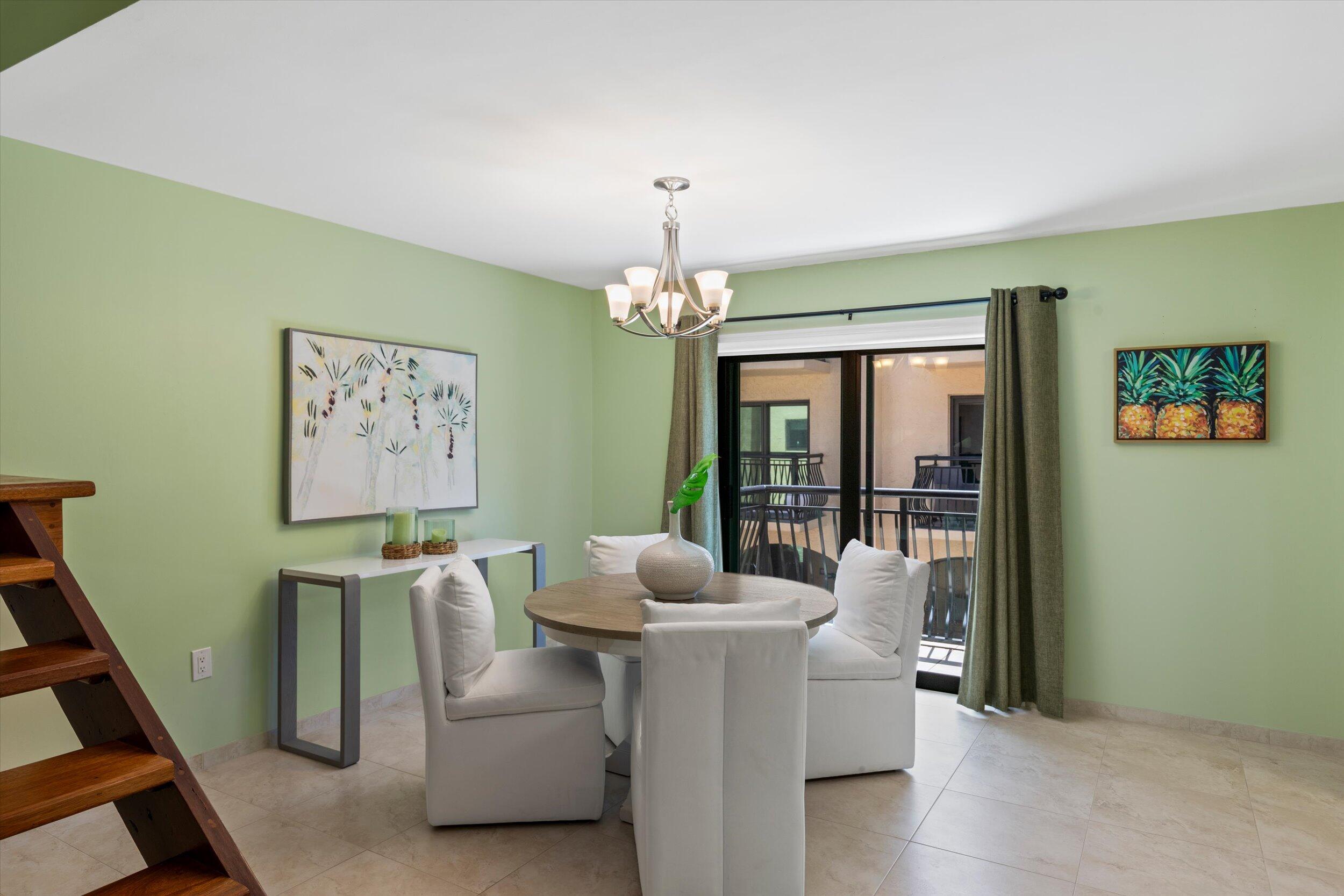 1616 Atlantic Boulevard, Unit 13 Key West, FL 33040 - Photo 21 of 38 a dining room with furniture and window