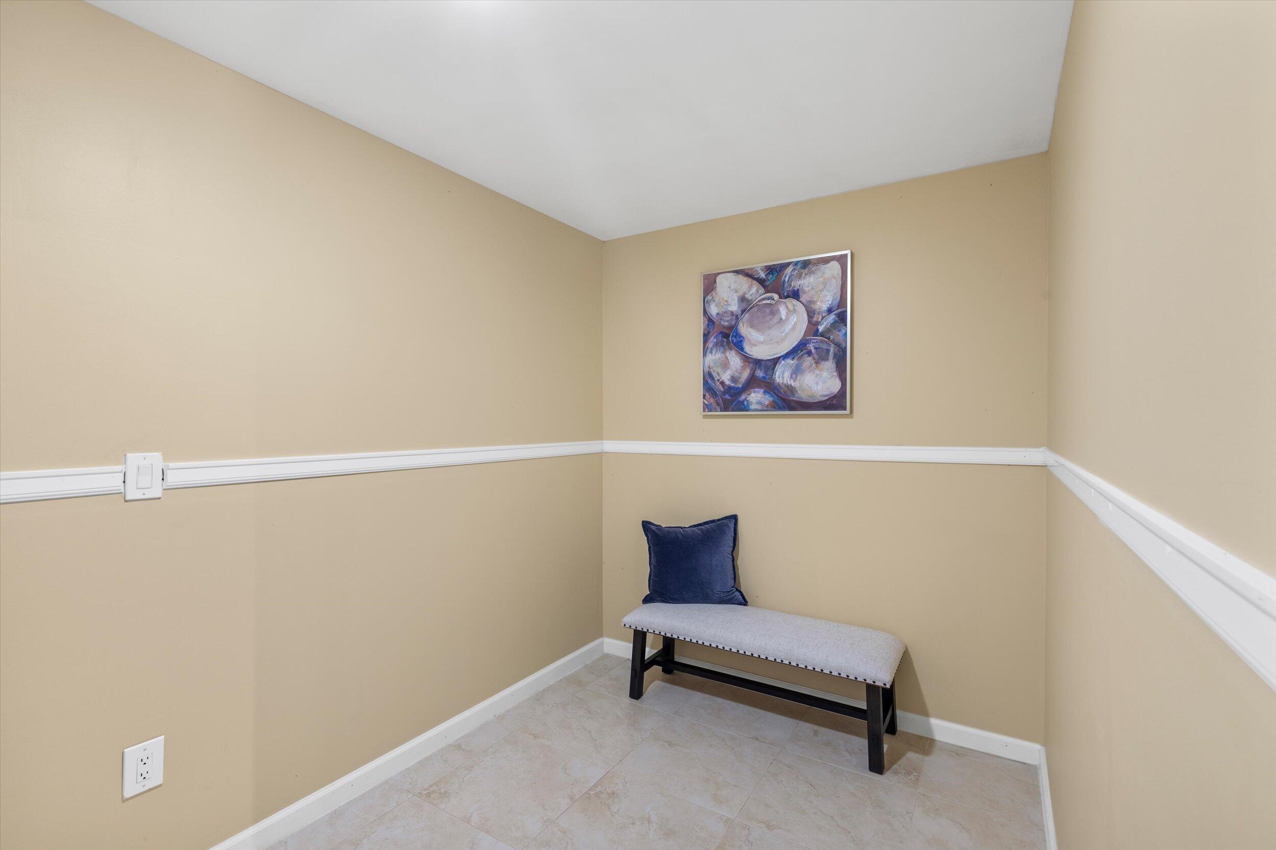 1616 Atlantic Boulevard, Unit 13 Key West, FL 33040 - Photo 25 of 38 a bench sitting in a room