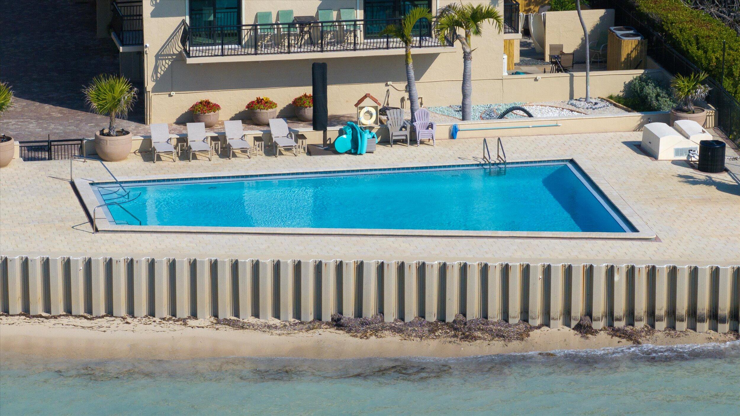 1616 Atlantic Boulevard, Unit 13 Key West, FL 33040 - Photo 31 of 38 a view of swimming pool with a patio