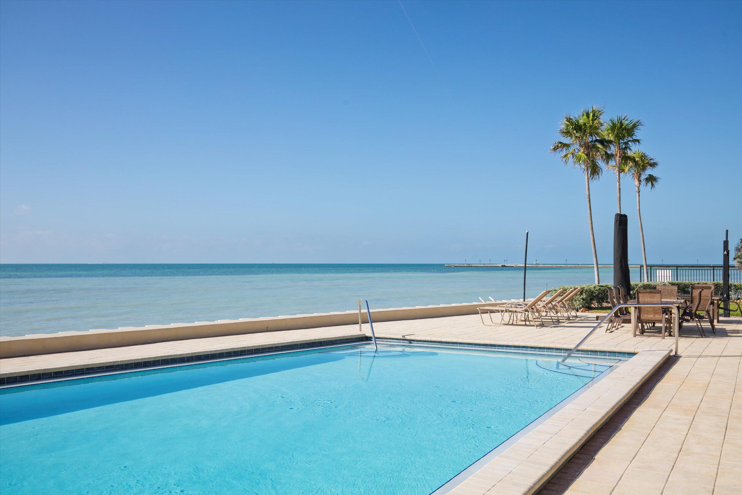 1616 Atlantic Boulevard, Unit 13 Key West, FL 33040 - Photo 35 of 38 a view of a swimming pool and an outdoor space