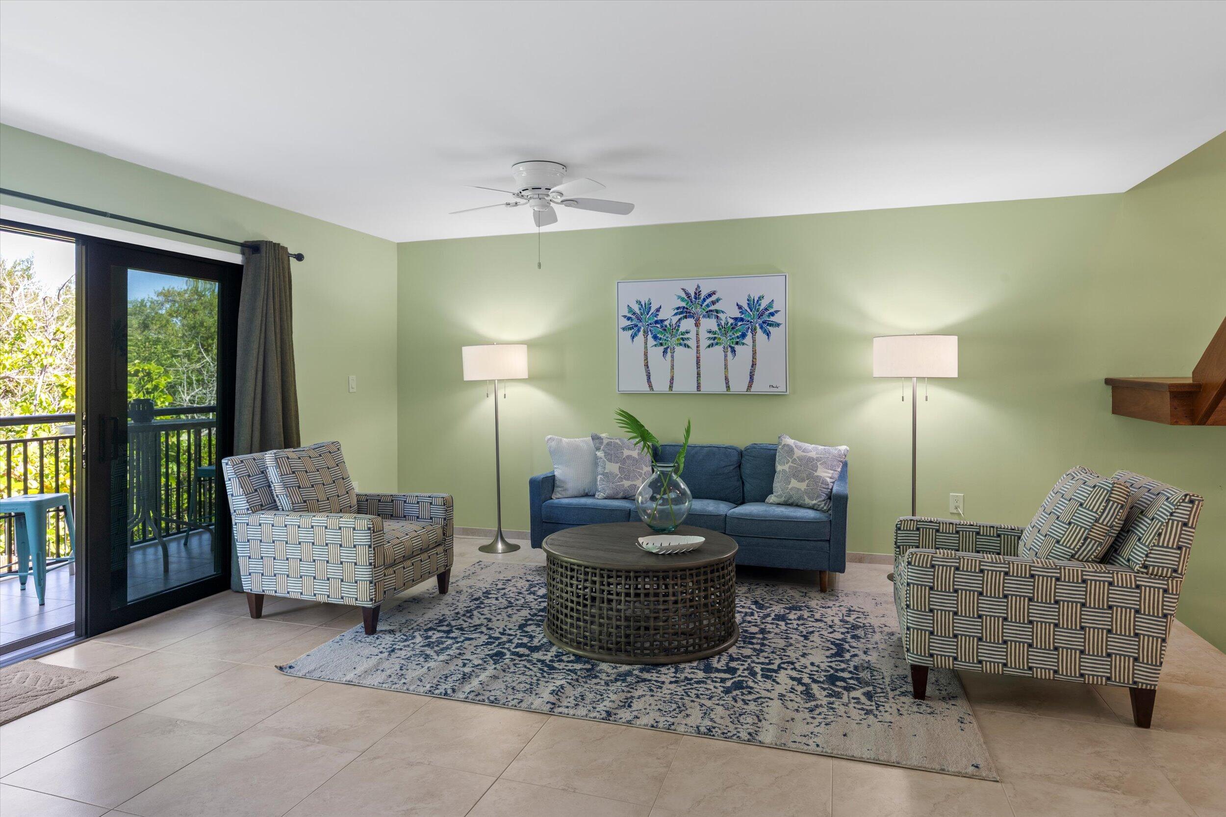 1616 Atlantic Boulevard, Unit 13 Key West, FL 33040 - Photo 6 of 38 a living room with furniture and a window