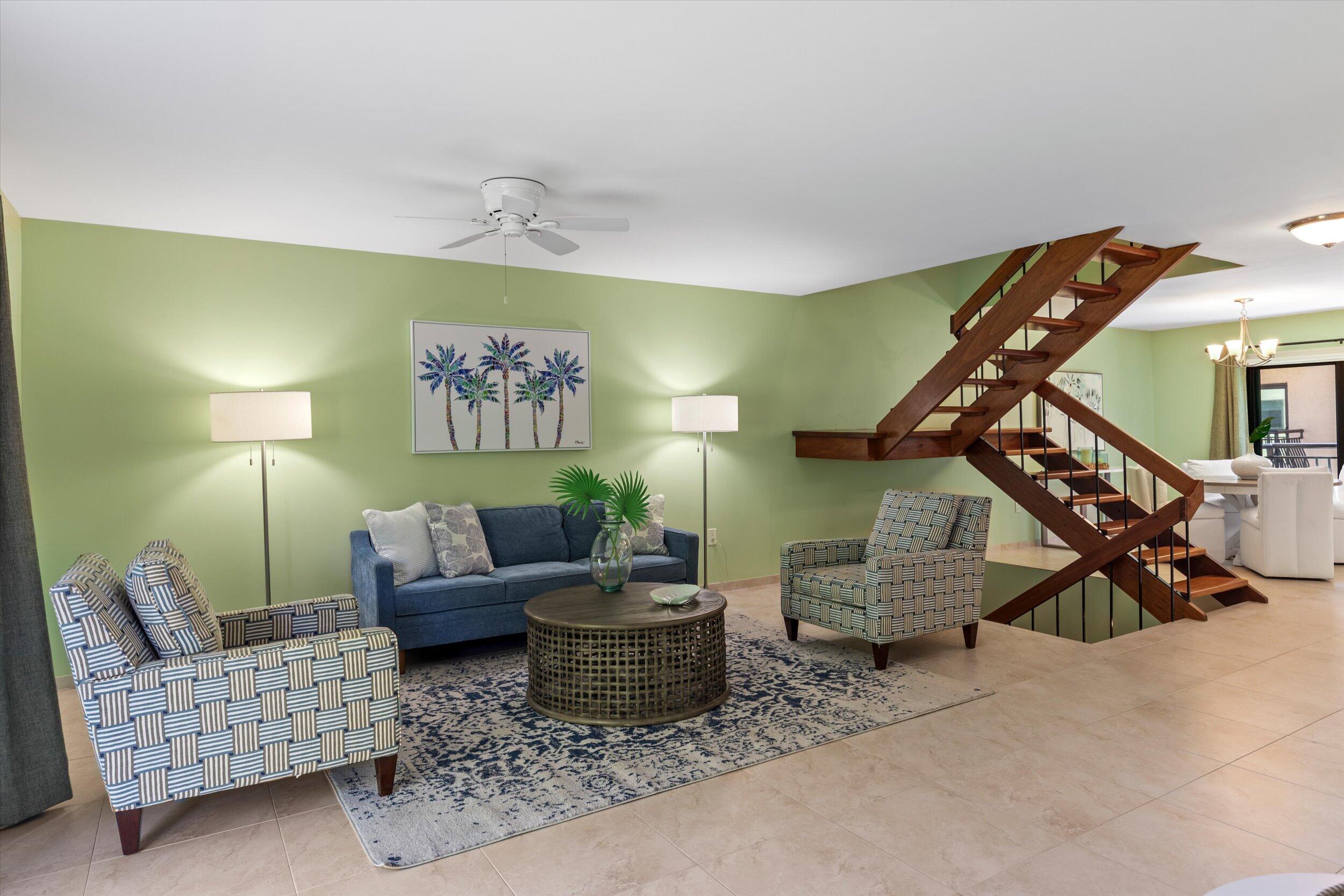 1616 Atlantic Boulevard, Unit 13 Key West, FL 33040 - Photo 10 of 38 a living room with furniture and stairs