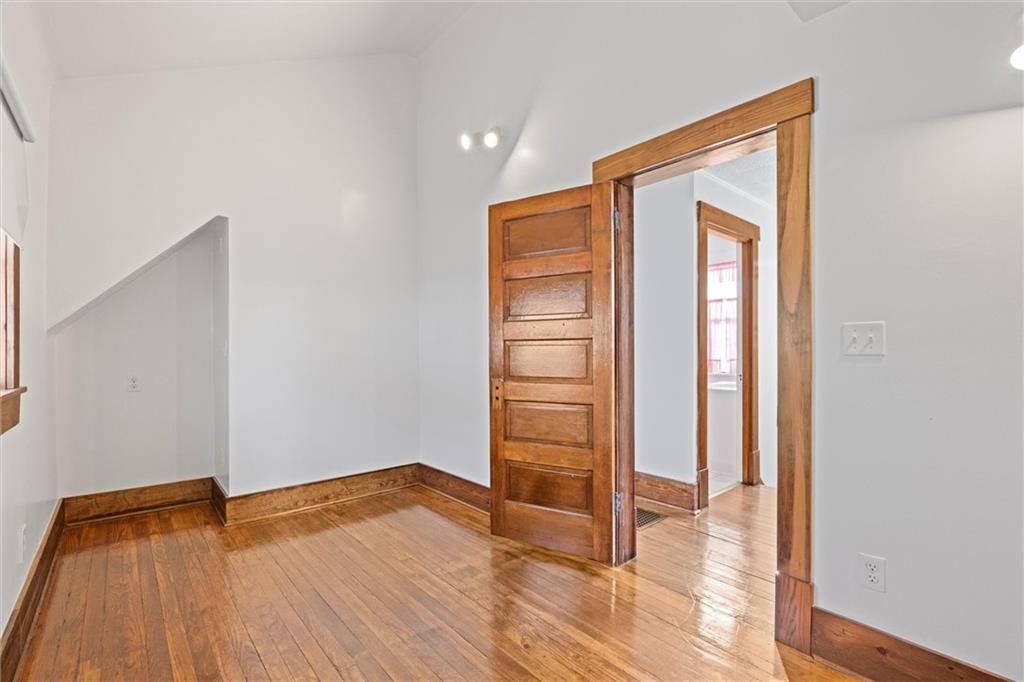 180 Center Street Springdale, PA 15144 - Photo 14 of 30 an empty room with wooden floor and closet