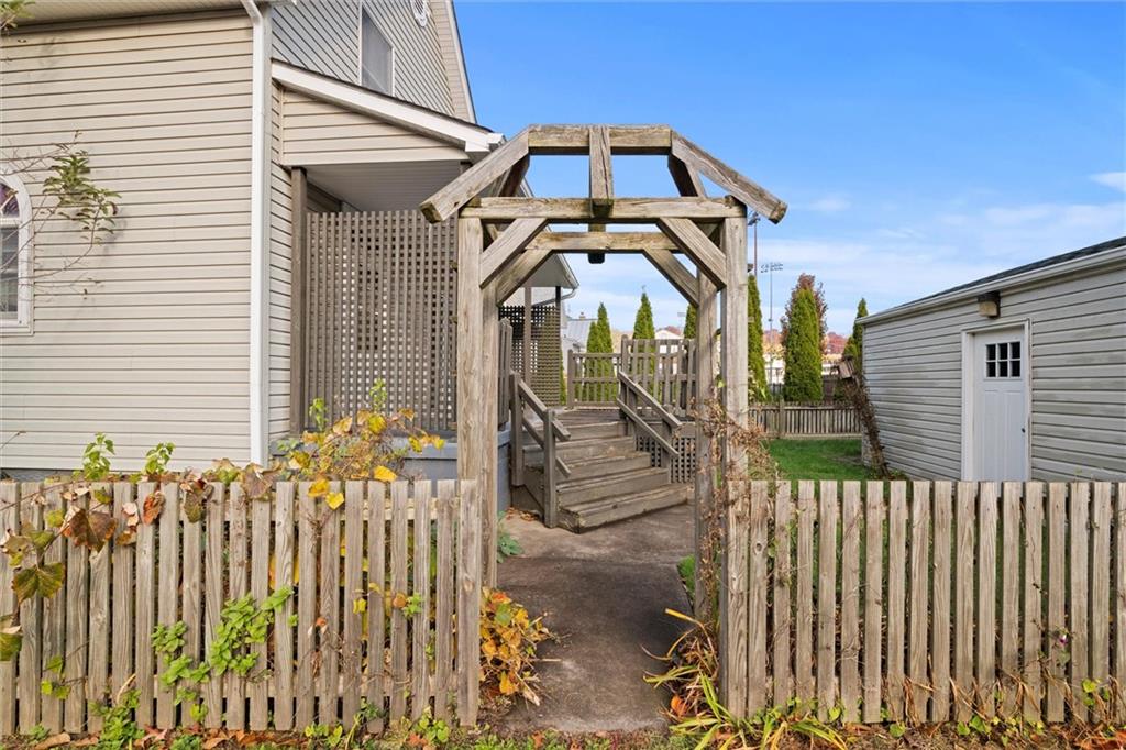 180 Center Street Springdale, PA 15144 - Photo 23 of 30 a front view of a house with a yard