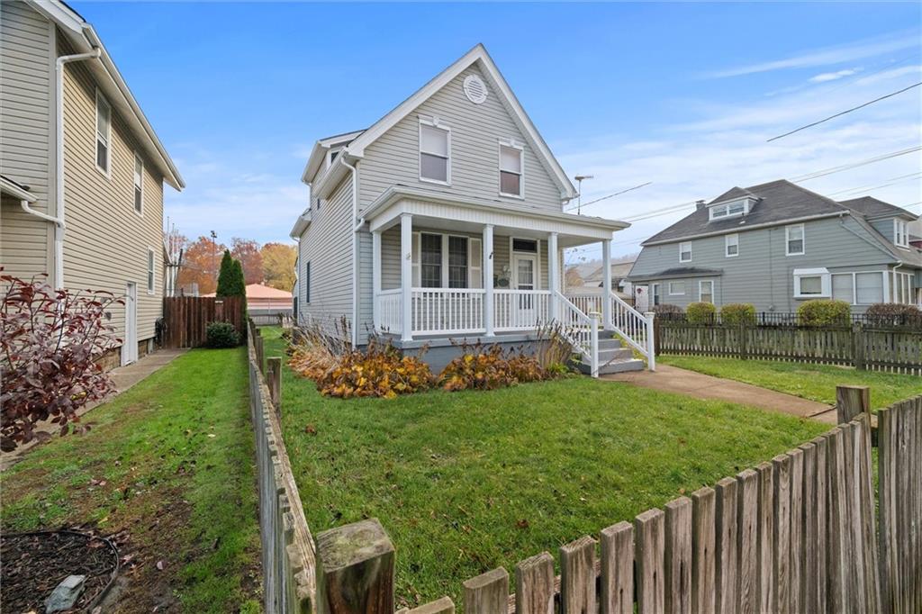 180 Center Street Springdale, PA 15144 - Photo 28 of 30 a front view of house with yard and green space