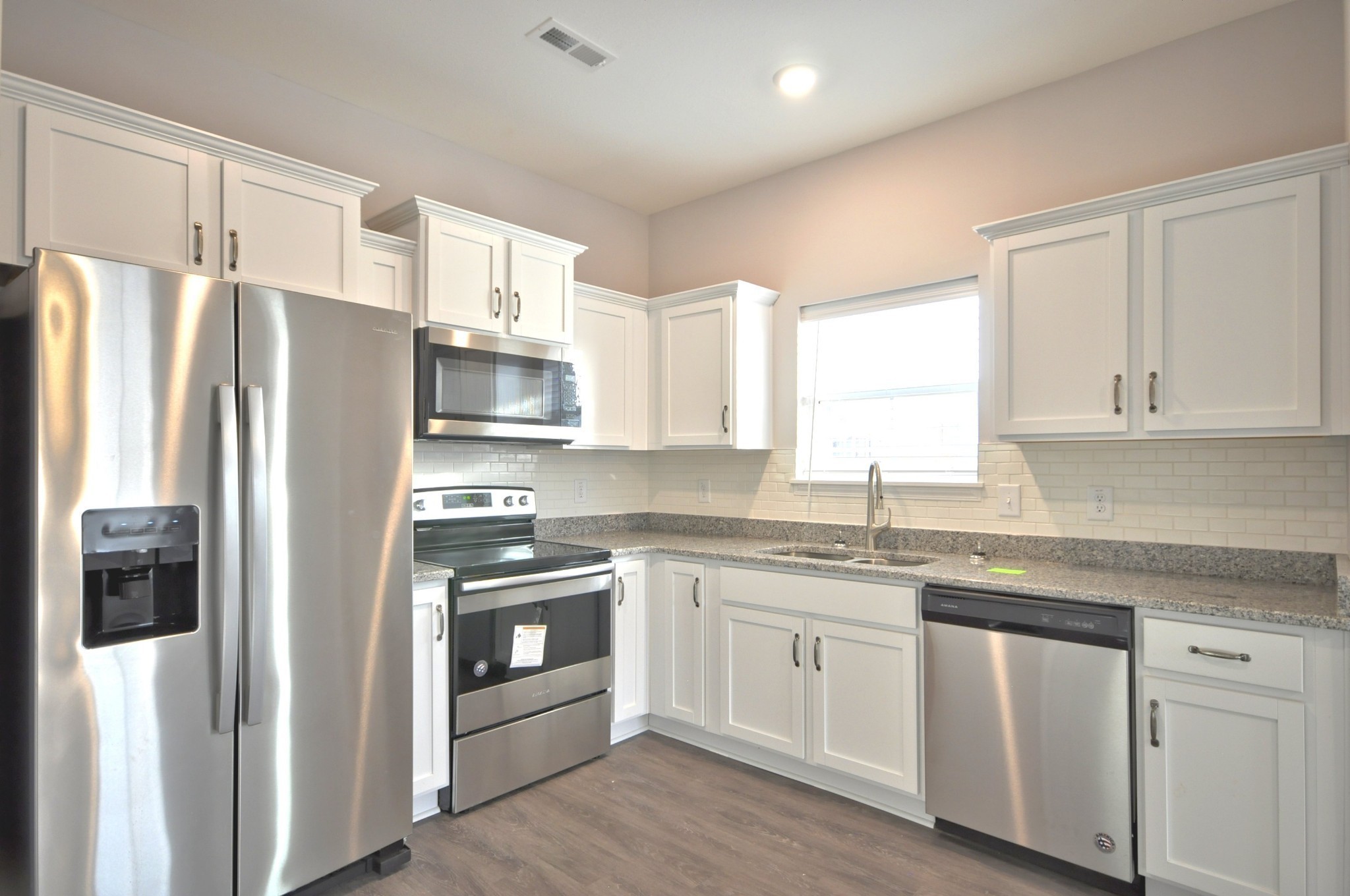 176 Bainbridge Drive, Unit B Clarksville, TN 37043 - Photo 9 of 31 a kitchen with stainless steel appliances granite countertop a refrigerator and a sink