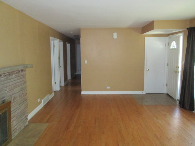 642 Wesley Drive Park Ridge, IL 60068 - Photo 6 of 11 a view of an empty room with wooden floor and a bathroom