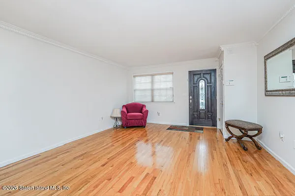 a view of a room with wooden floor and cabinet