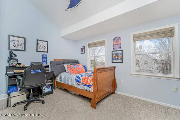 a bed room with furniture and a window