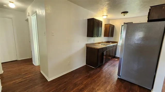 a stove top oven sitting inside of a kitchen