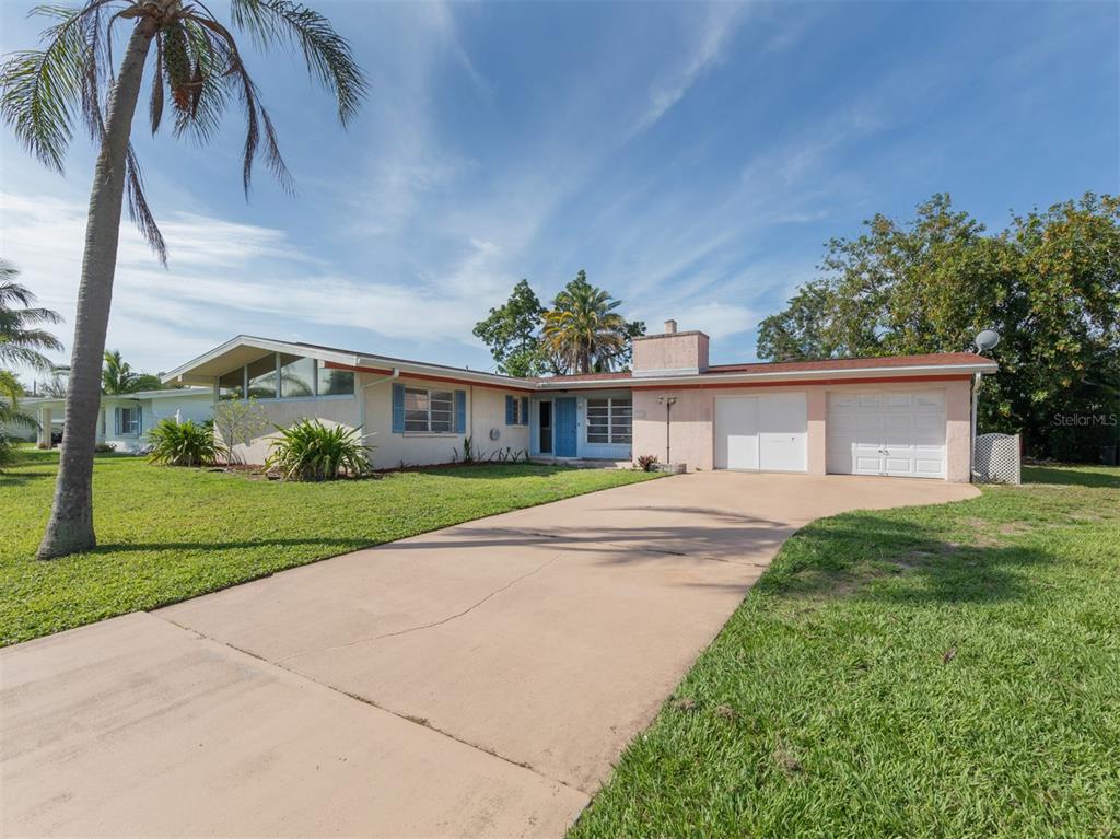 348 Hillview Road Venice, FL 34293 - Photo 1 of 1 a front view of house with yard and green space