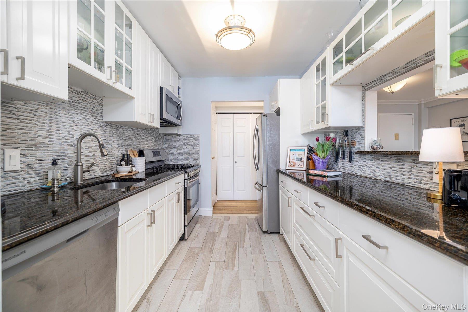 522 Shore Road, Unit 6M Long Beach, NY 11561 - Photo 11 of 28 Renovated kitchen with stainless steel appliances