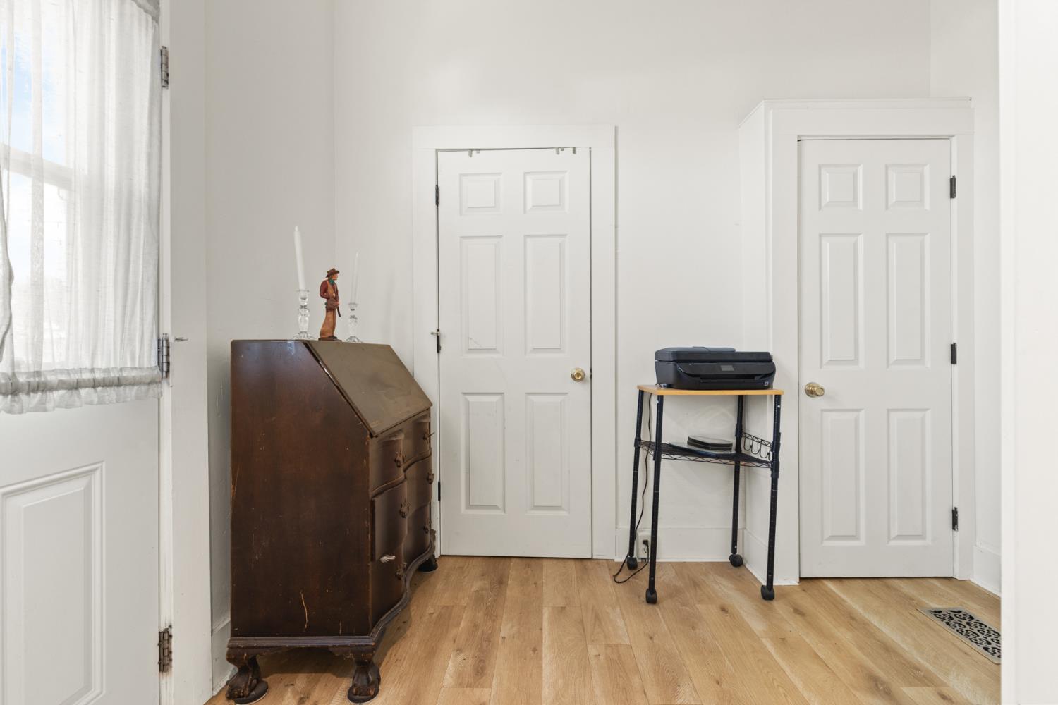 490 Hazel Street Gridley, CA 95948 - Photo 14 of 28 a view of hallway with wooden floor and cabinet