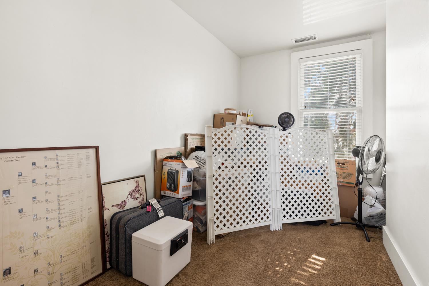 490 Hazel Street Gridley, CA 95948 - Photo 20 of 28 a bedroom with a couch and a window