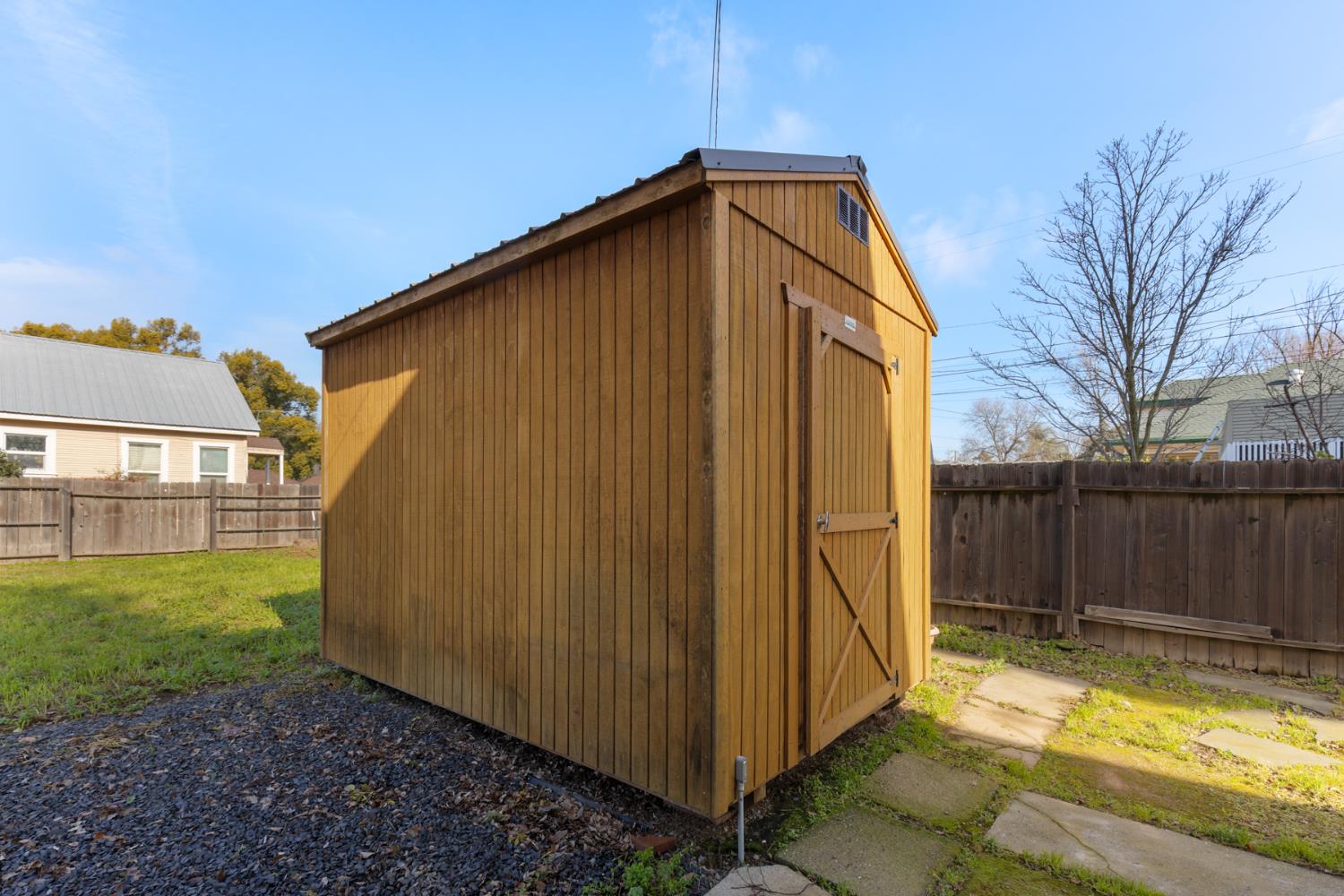 490 Hazel Street Gridley, CA 95948 - Photo 25 of 28 a view of a backyard with wooden fence