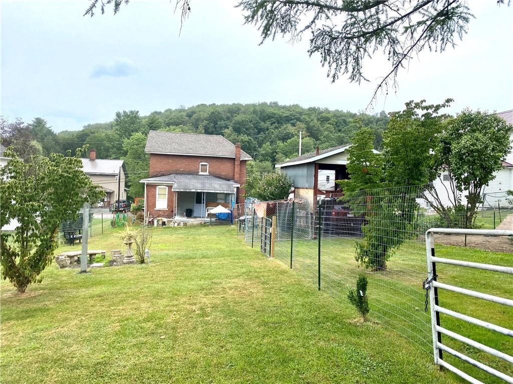 3967 Stiffler Hill Road Cherry Tree, PA 15724 - Photo 12 of 18 a view of house in front of a big yard with large trees