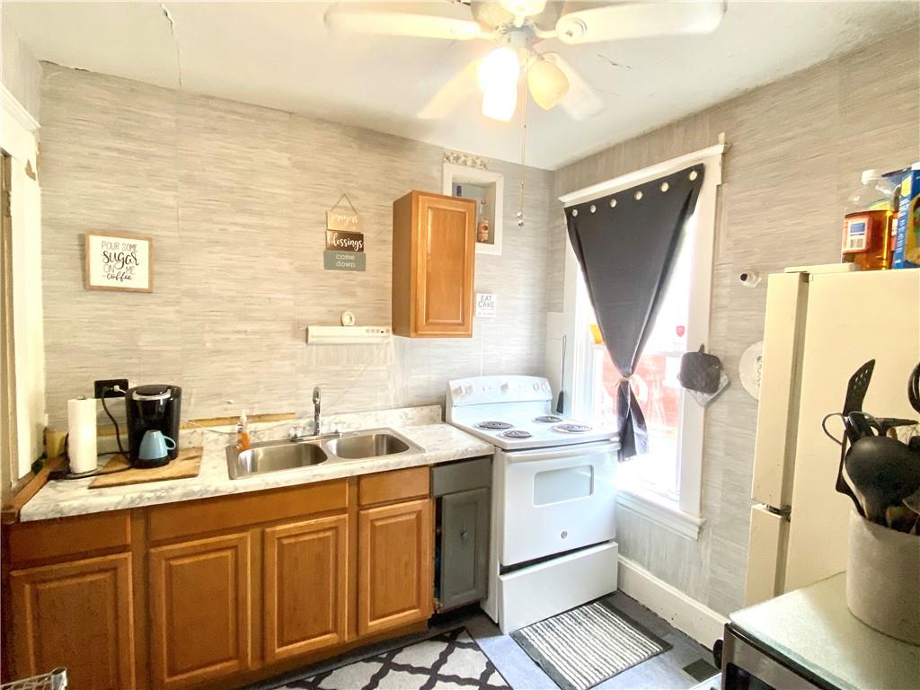 3967 Stiffler Hill Road Cherry Tree, PA 15724 - Photo 7 of 18 a kitchen with a sink appliances and cabinets