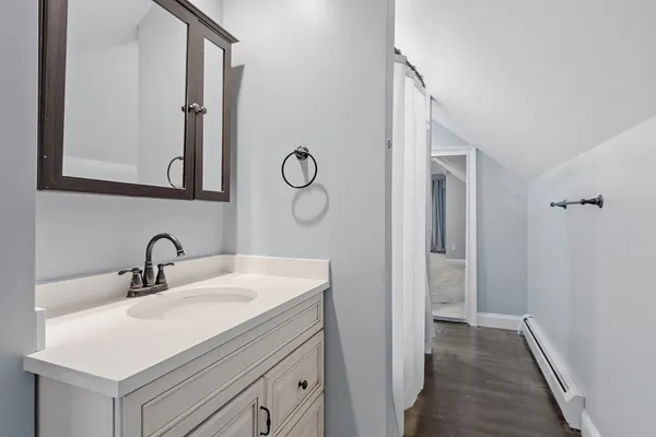 a bathroom with a sink and a mirror