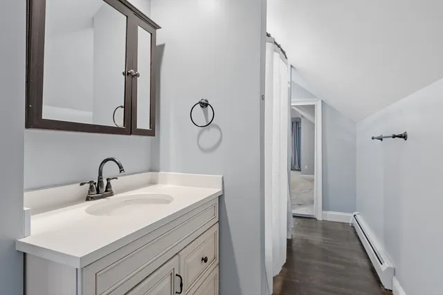 a bathroom with a sink and a mirror