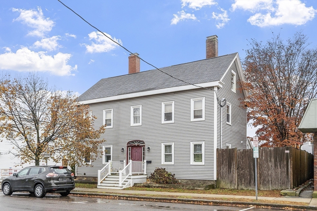 35 High Street, Unit 3D Danvers, MA 01923 - Photo 19 of 21 a front view of a house with a yard