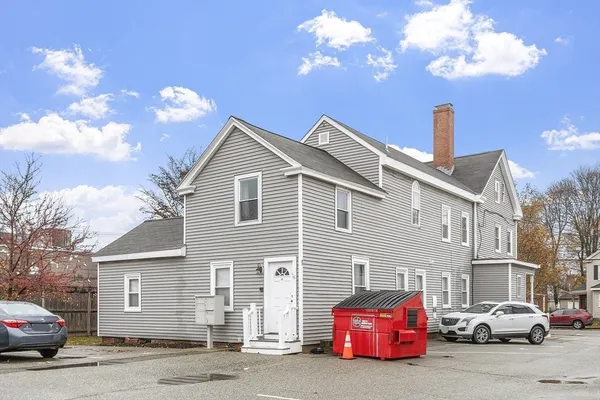 a front view of a house with parking