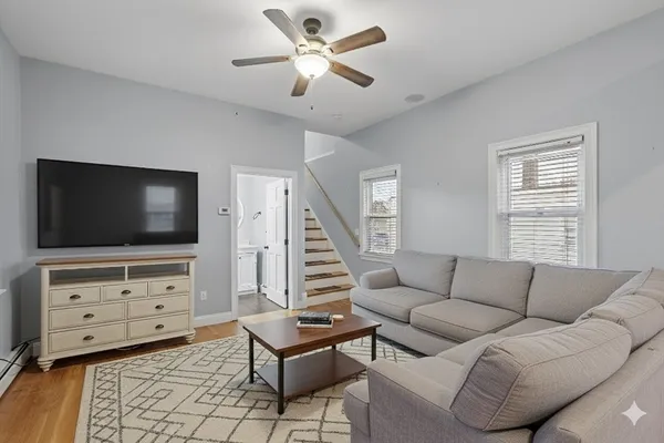 a living room with furniture and a flat screen tv