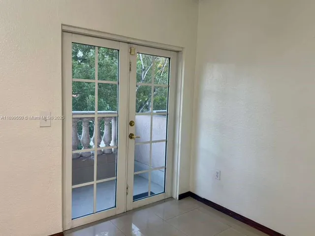 a view of a bathroom with a glass door