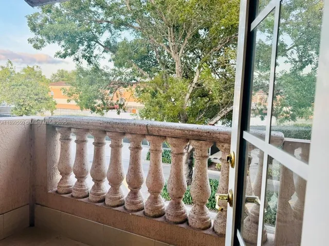 a view of a porch with wooden floor