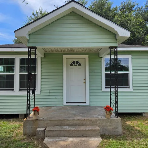a front view of a house with street