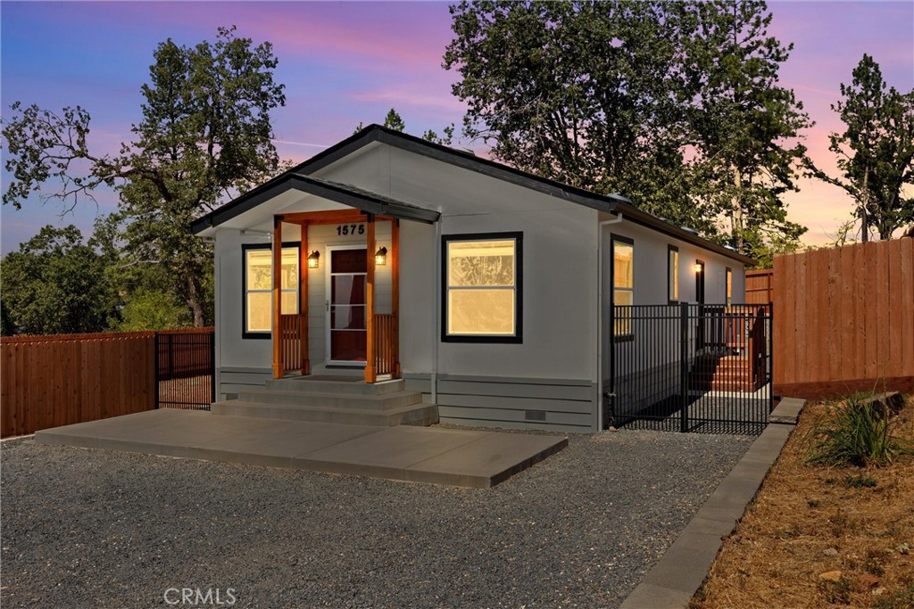 a front view of a house with yard