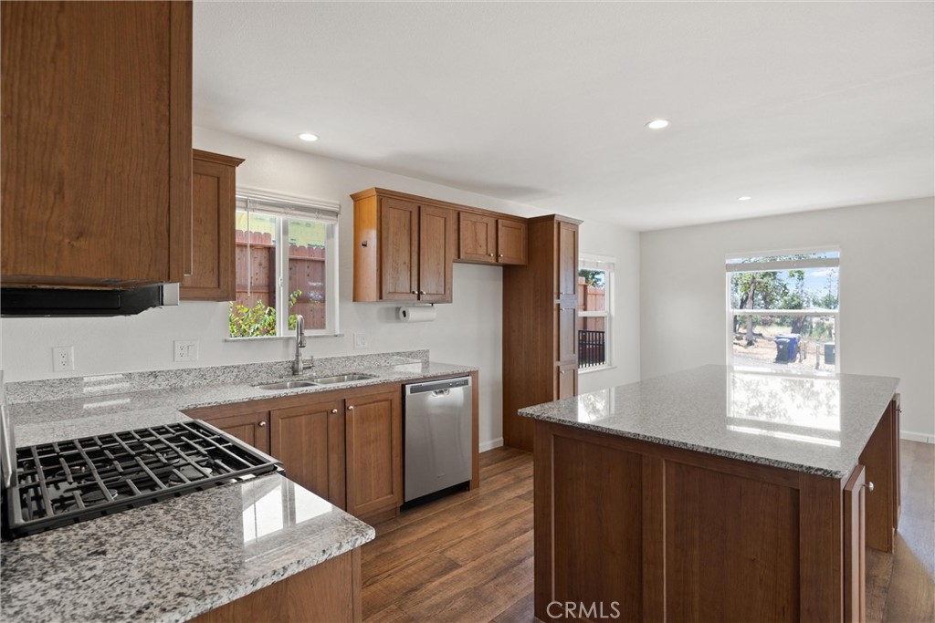 1575 La Grand View Road Paradise, CA 95969 - Photo 12 of 38 a kitchen with stainless steel appliances granite countertop a sink stove and refrigerator