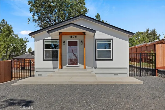 a front view of a house with a garage