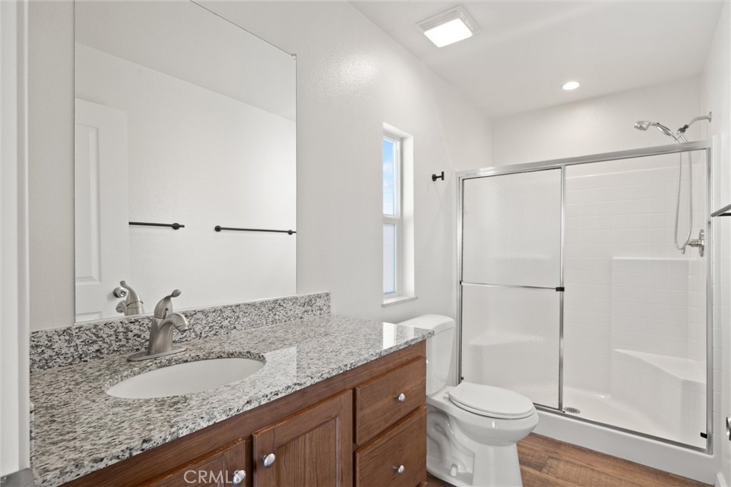 1575 La Grand View Road Paradise, CA 95969 - Photo 22 of 38 a bathroom with a granite countertop sink toilet and shower